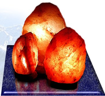 Group of lit natural salt lamps on a table